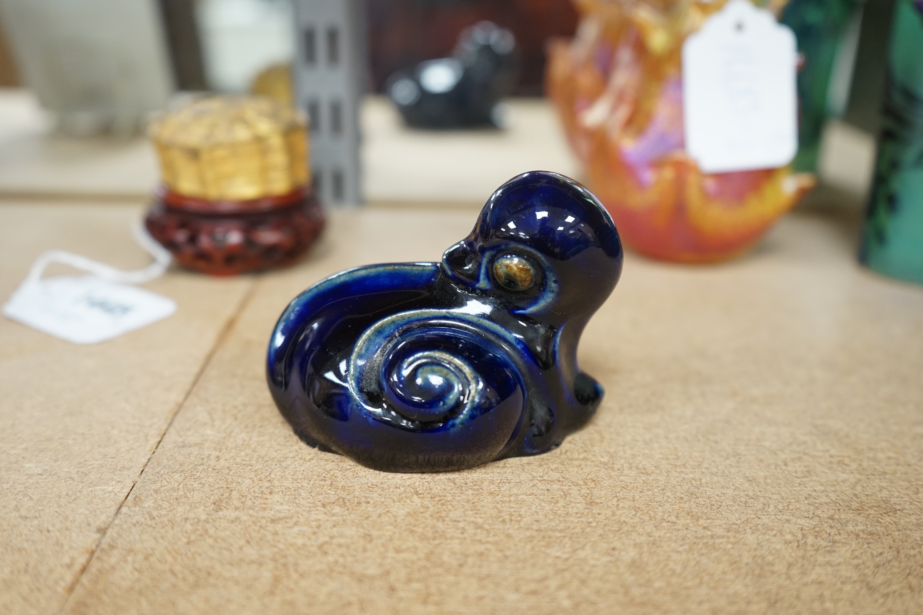 A Royal Doulton stoneware grotesque blue glazed 'duck' by Mark V. Marshall, 9cm wide. Condition - good